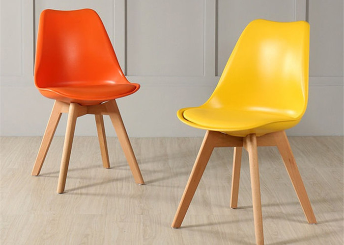 Buy cheap High-quality modern colorful plastic tulip dining chair with beech wood legs, suitable for dining room and living room product