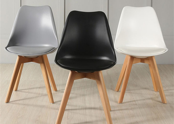 Buy cheap High-quality modern beech wood legs tulip colored plastic dining chair, from wholesalers