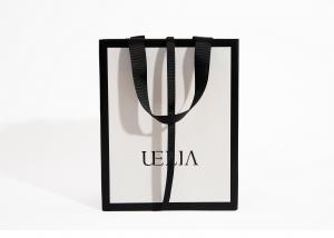 China Custom Printed White Luxury Boutique Paper Bag 250g For Clothes on sale