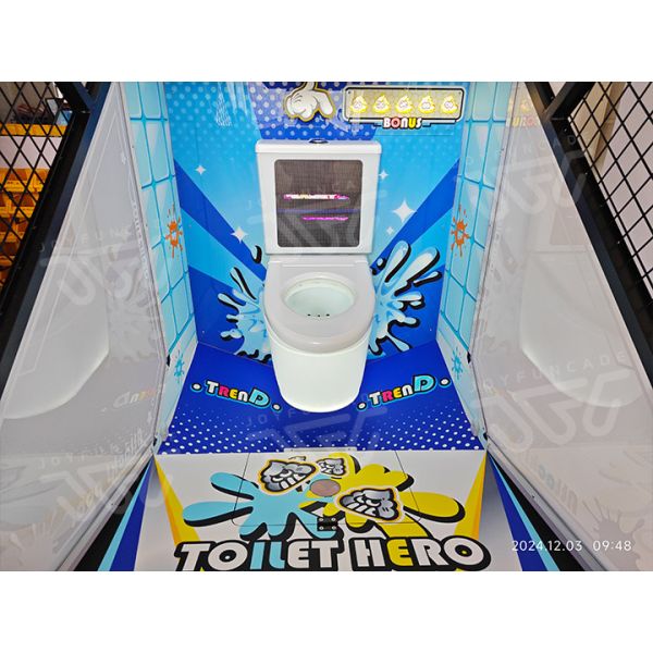 Toilet Hero arcade machine gameplay close-up showing ball tossing action