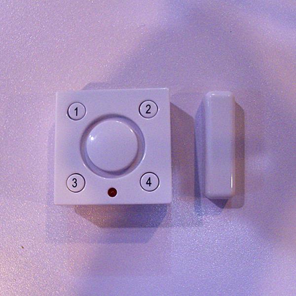 Solar power vibration magnetic contact alarm with rechargeable Li-Ion backup batter