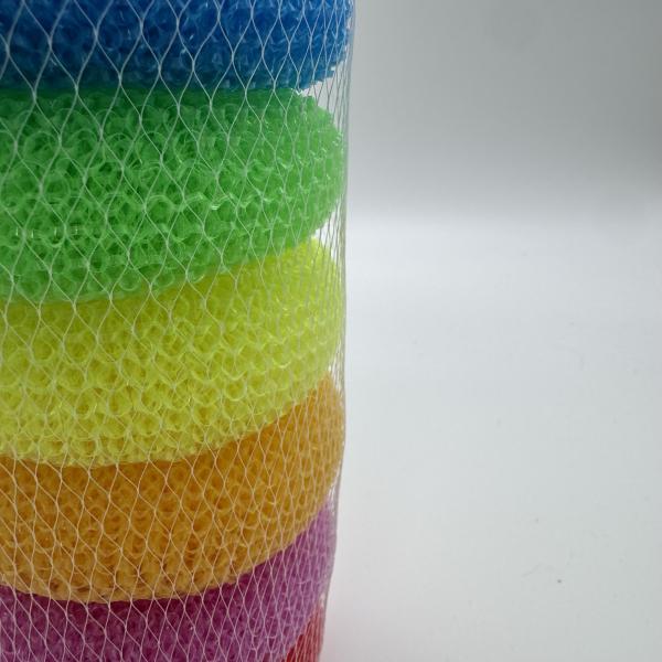 Close-up of plastic mesh scrub ball cleaning cookware