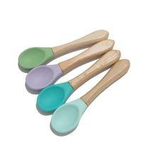 China Wooden Handle Infant Feeding Spoon BPA Free Food Grade Soft Silicone Baby Spoon on sale
