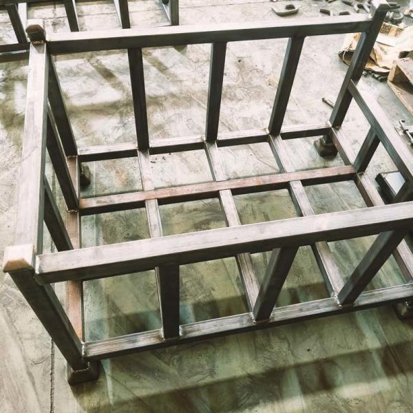 Side view of folded wire mesh container