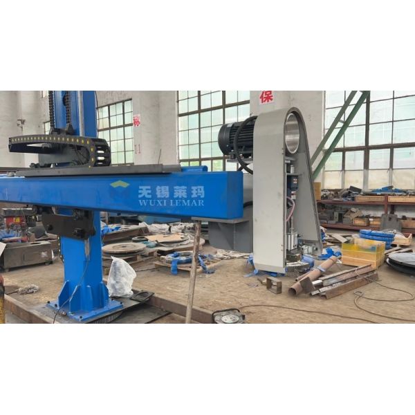 Close-up view of welding torch and tracking system on HJ8080 manipulator